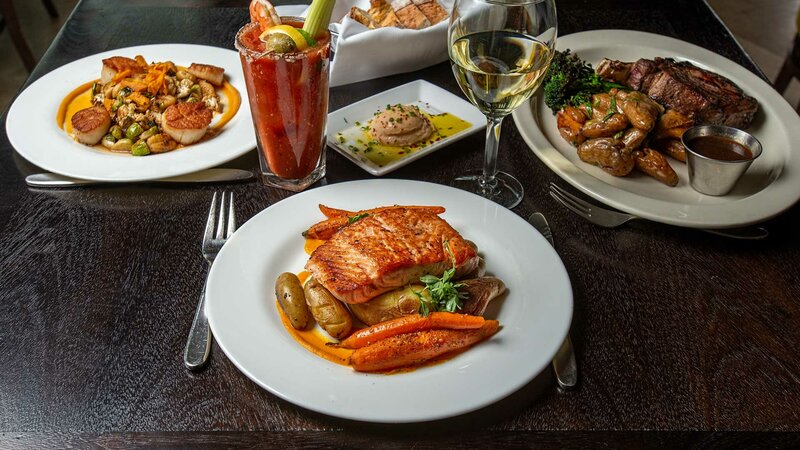 Salmon entree with side of potatoes and vegetables